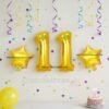 Golden number 11 foil balloon (16 inch) with two golden star balloons (10 inch) for party decoration