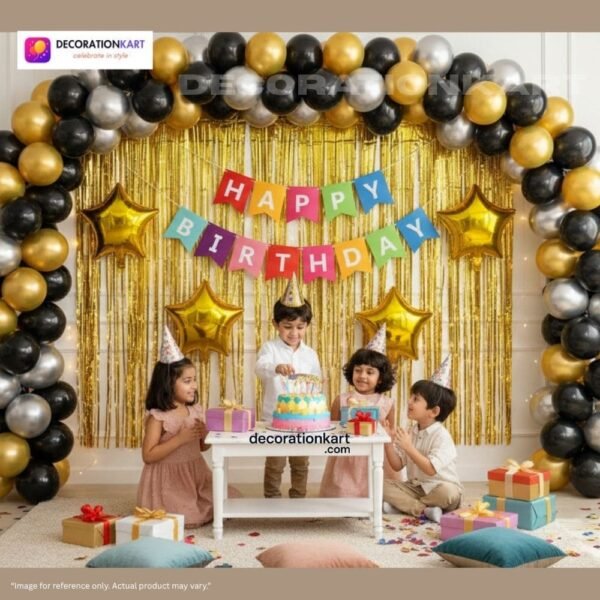 Birthday party setup with DECORATIONkart’s 66 pcs decoration kit featuring a multicolor cardstock “Happy Birthday” banner, golden fringe curtains, metallic balloons in golden, black, and silver, golden star foils, and DIY accessories.