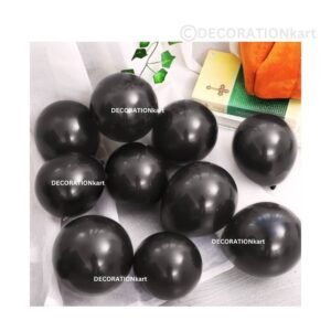 Glossy black chrome latex balloons floating in a bold and elegant party setup with gold accents and ambient lighting.