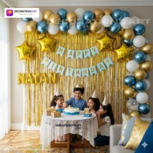 Birthday party setup with DECORATIONkart’s 66 pcs decoration kit featuring a blue cardstock “Happy Birthday” banner, golden fringe curtains, metallic balloons in golden, blue, and white, golden star foils, and DIY accessories.