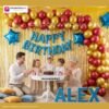 Indian children celebrating a birthday party with DECORATIONkart’s 66 pcs decoration combo set, featuring a blue dotted foil “Happy Birthday” banner, golden fringe curtains, metallic balloons in gold, yellow, and red, blue star foil balloons, and DIY accessories