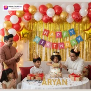Birthday party setup with DECORATIONkart’s 66 pcs decoration kit featuring a multicolor cardstock “Happy Birthday” banner, golden fringe curtains, metallic balloons in golden, red, and white, golden star foils, and DIY accessories.
