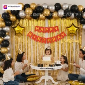 Birthday party setup with DECORATIONkart’s 66 pcs decoration kit featuring a red cardstock “Happy Birthday” banner, golden fringe curtains, metallic balloons in golden, black, and silver, golden star foils, and DIY accessories.