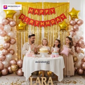 Birthday party setup with DECORATIONkart’s 66 pcs decoration kit featuring a red cardstock “Happy Birthday” banner, golden fringe curtains, metallic balloons in golden, pink, and white, golden star foils, and DIY accessories.