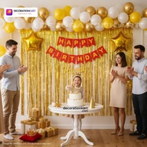 Birthday party setup with DECORATIONkart’s 66 pcs decoration kit featuring a red cardstock “Happy Birthday” banner, golden fringe curtains, metallic balloons in golden, yellow, and white, golden star foils, and DIY accessories.