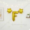 Golden foil balloon combo featuring letter 'F' (16 inch) and two star-shaped balloons (9 inch) for party decoration