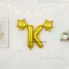 Golden foil balloon combo featuring letter 'K' (16 inch) and two star-shaped balloons (9 inch) for party decoration