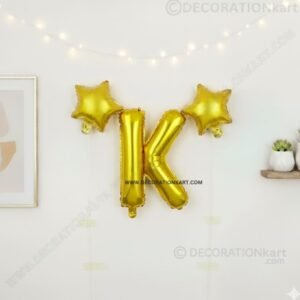 Golden foil balloon combo featuring letter 'K' (16 inch) and two star-shaped balloons (9 inch) for party decoration