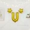 Golden foil balloon combo featuring letter 'U' (16 inch) and two star-shaped balloons (9 inch) for party decoration