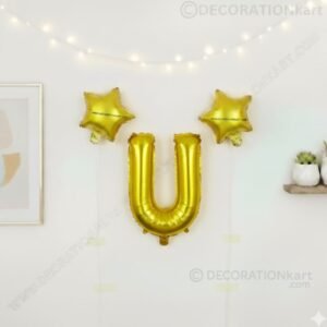 Golden foil balloon combo featuring letter 'U' (16 inch) and two star-shaped balloons (9 inch) for party decoration