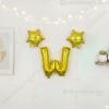 Golden foil balloon combo featuring letter 'W' (16 inch) and two star-shaped balloons (9 inch) for party decoration