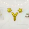 Golden foil balloon combo featuring letter 'Y' (16 inch) and two star-shaped balloons (9 inch) for party decoration