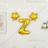 Golden foil balloon combo featuring letter 'Z' (16 inch) and two star-shaped balloons (9 inch) for party decoration