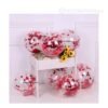 Glossy red metallic latex balloons floating in a romantic and festive party setup.