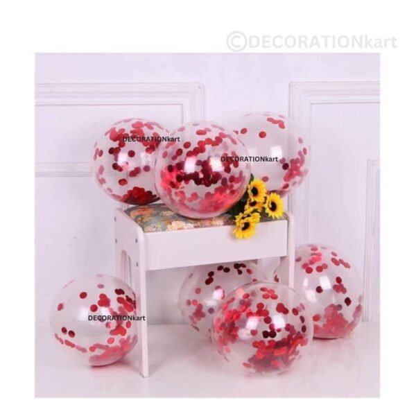 Glossy red metallic latex balloons floating in a romantic and festive party setup.