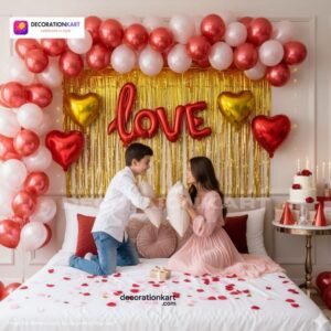 Romantic couple party setup with DECORATIONkart’s 57 pcs decoration kit featuring a red foil “LOVE” banner, golden fringe curtains, metallic balloons in pink, red, and white, heart foil balloons, and DIY accessories.