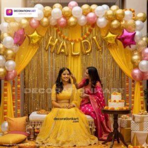 Haldi ceremony setup with DECORATIONkart’s 58 pcs decoration kit featuring a golden foil “Haldi” banner, golden fringe curtains, metallic balloons in golden, pink, and white, multicolor star foils, and DIY accessories.