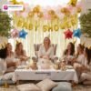 Baby shower party setup with DECORATIONkart’s 63 pcs decoration kit featuring a golden foil “Baby Shower” banner, golden fringe curtains, metallic balloons in golden, pink, and white, multicolor star foils, and DIY accessories.