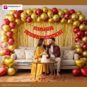 Anniversary party setup with DECORATIONkart’s 69 pcs decoration kit featuring a red cardstock “Happy Anniversary” banner, golden fringe curtains, metallic balloons in golden, yellow, and red, golden and red heart foils, and DIY accessories.