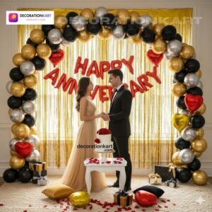 Anniversary party setup with DECORATIONkart’s 69 pcs decoration kit featuring a red foil “Happy Anniversary” banner, golden fringe curtains, metallic balloons in golden, black, and silver, golden and red heart foils, and DIY accessories.